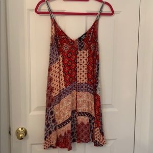 Printed “patched” spaghetti strap mini dress.